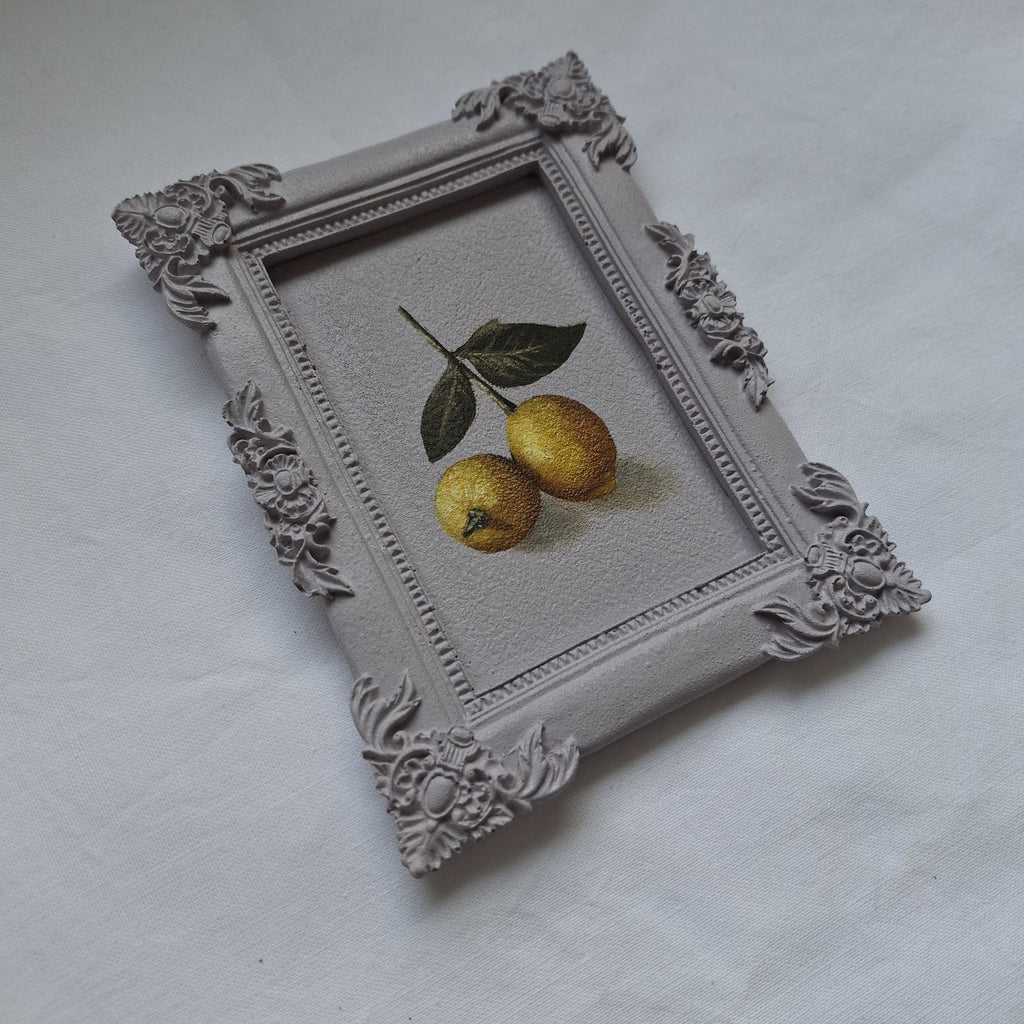 Lemons in a plaster frame