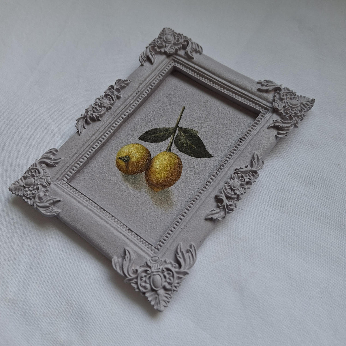 Lemons in a plaster frame