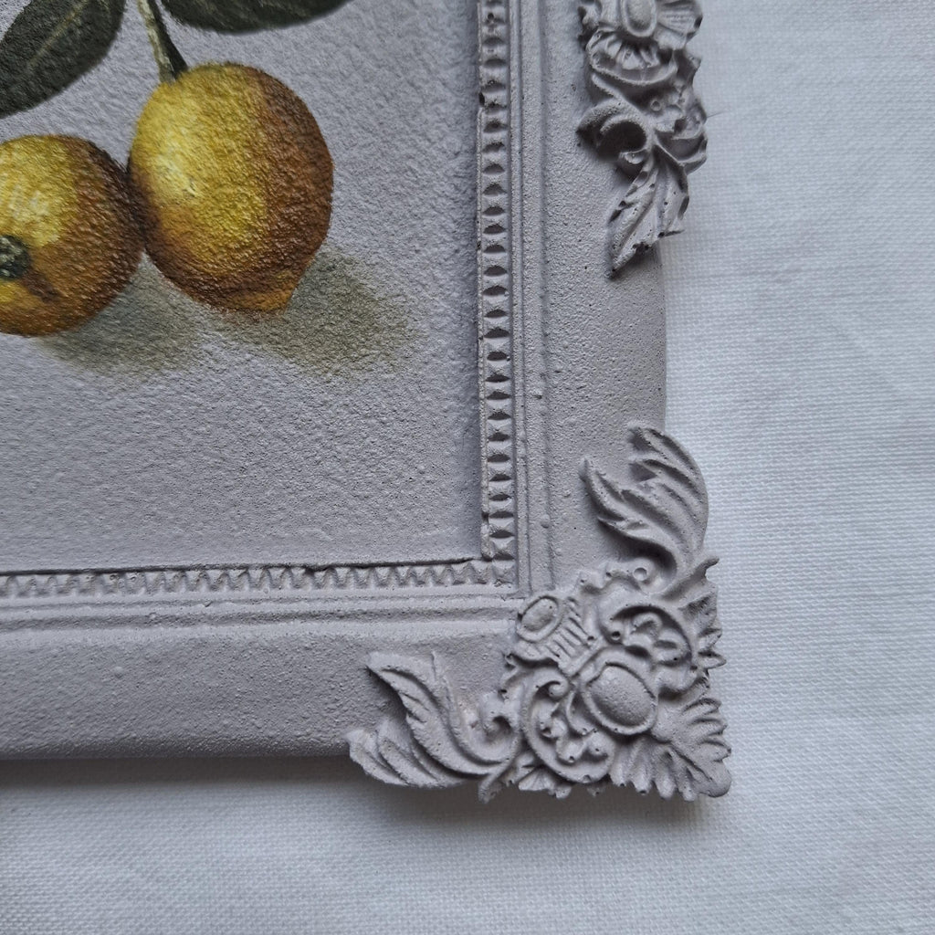 Lemons in a plaster frame
