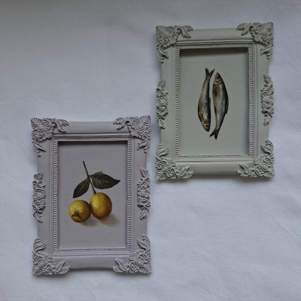 Lemons in a plaster frame